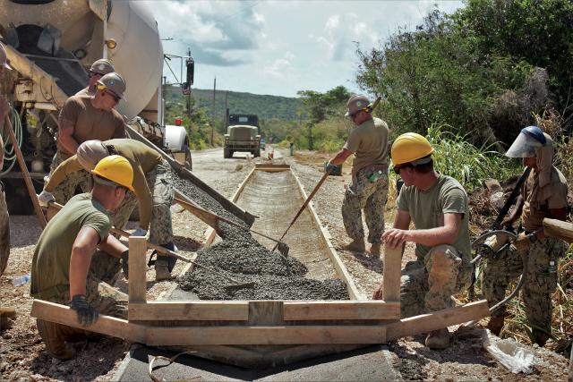 Seabees complete a road construction project on Tinian. The Naval Construction Force contributes significantly to the fight by building infrastructure. 