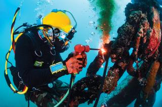 A diver with Underwater Construction Team 2 (UCT 2) performs underwater cutting operations. UCTs provide construction, maintenance, and repair of underwater and waterfront facilities in support of the Pacific Fleet. 