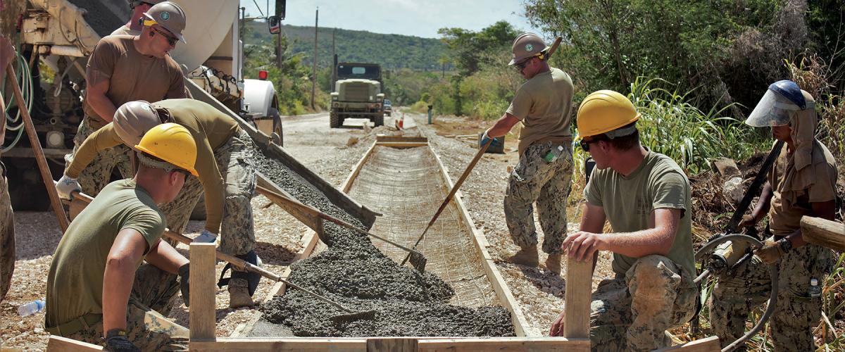 Seabees complete a road construction project on Tinian. The Naval Construction Force contributes significantly to the fight by building infrastructure. 
