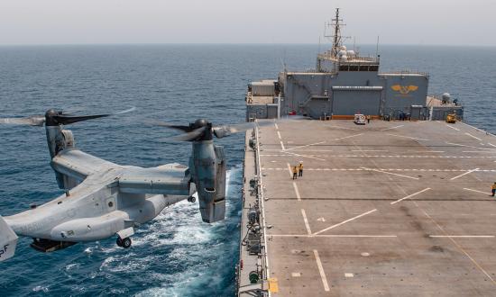 An MV-22 Osprey prepares to land on board the expeditionary sea base USS Lewis B. Puller (ESB-3) in the Persian Gulf. The ESBs have expansive flight decks and the capacity to deliver several hundred Marines and their associated cargo and weapons at transoceanic distances. 