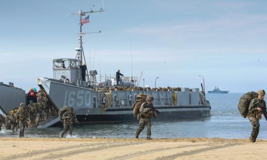Landing Craft Utility 1650 disembarks Marines during an amphibious exercise. The success of EABO will depend on the Marine Corps' ability to land Marines and their equipment quickly and replenish them as needed.