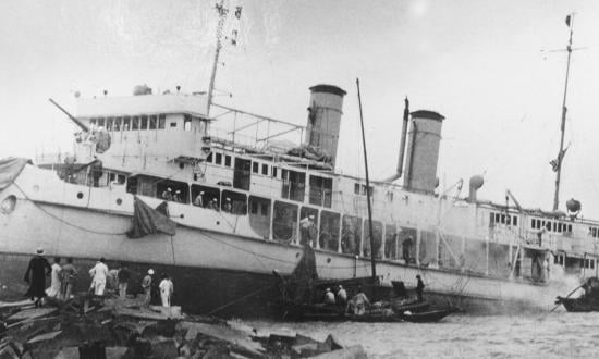 The USS Luzon (PR-4) run aground on her trial run in Shanghai, China, 1929.   (Credit: U.S. Navy Photo, Courtesy of Rear Admiral Kemp Tolley, USN)